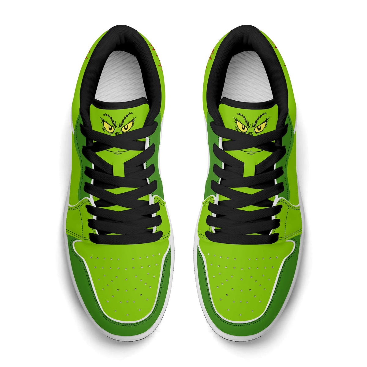 Top view of Naughty & Nice Christmas low tops with black laces and a grumpy green face on the tongue