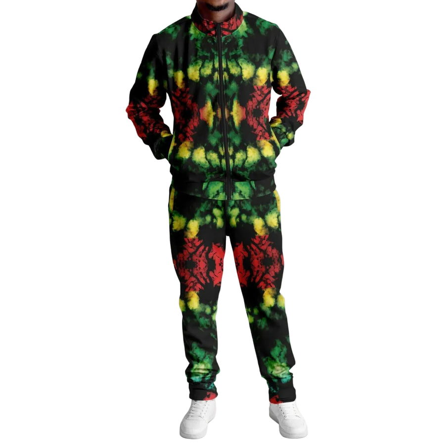 A person wearing a Rasta tracksuit with red, yellow, and green colors, standing against a white background.
