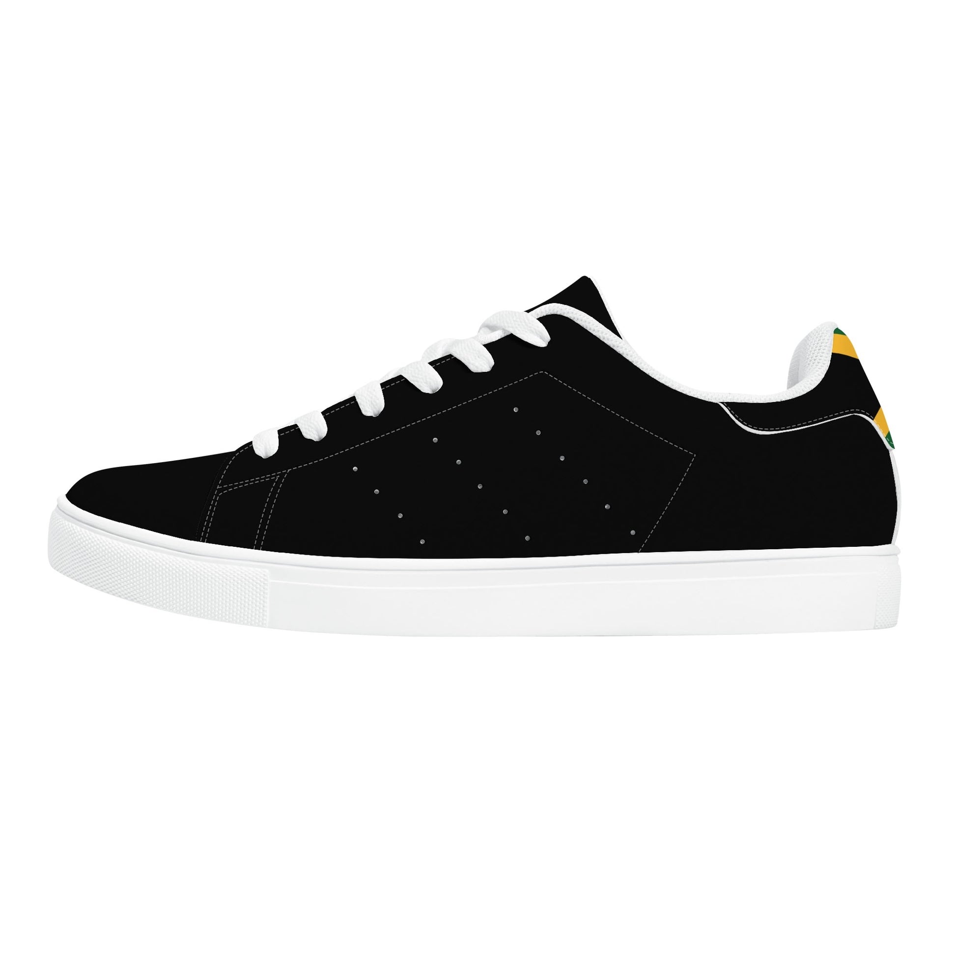 All-black Jamaica flag Ackee Walkers low top sneakers with black laces, black outsole and a green and gold Jamaican flag chevron at the heel