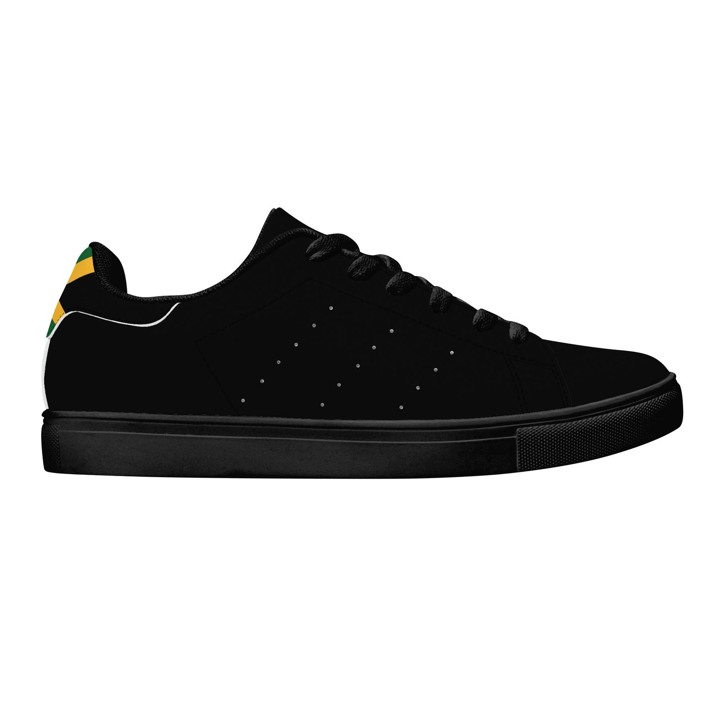 All-black Jamaica flag Ackee Walkers low top sneakers with black laces, black outsole and a green and gold Jamaican flag chevron at the heel
