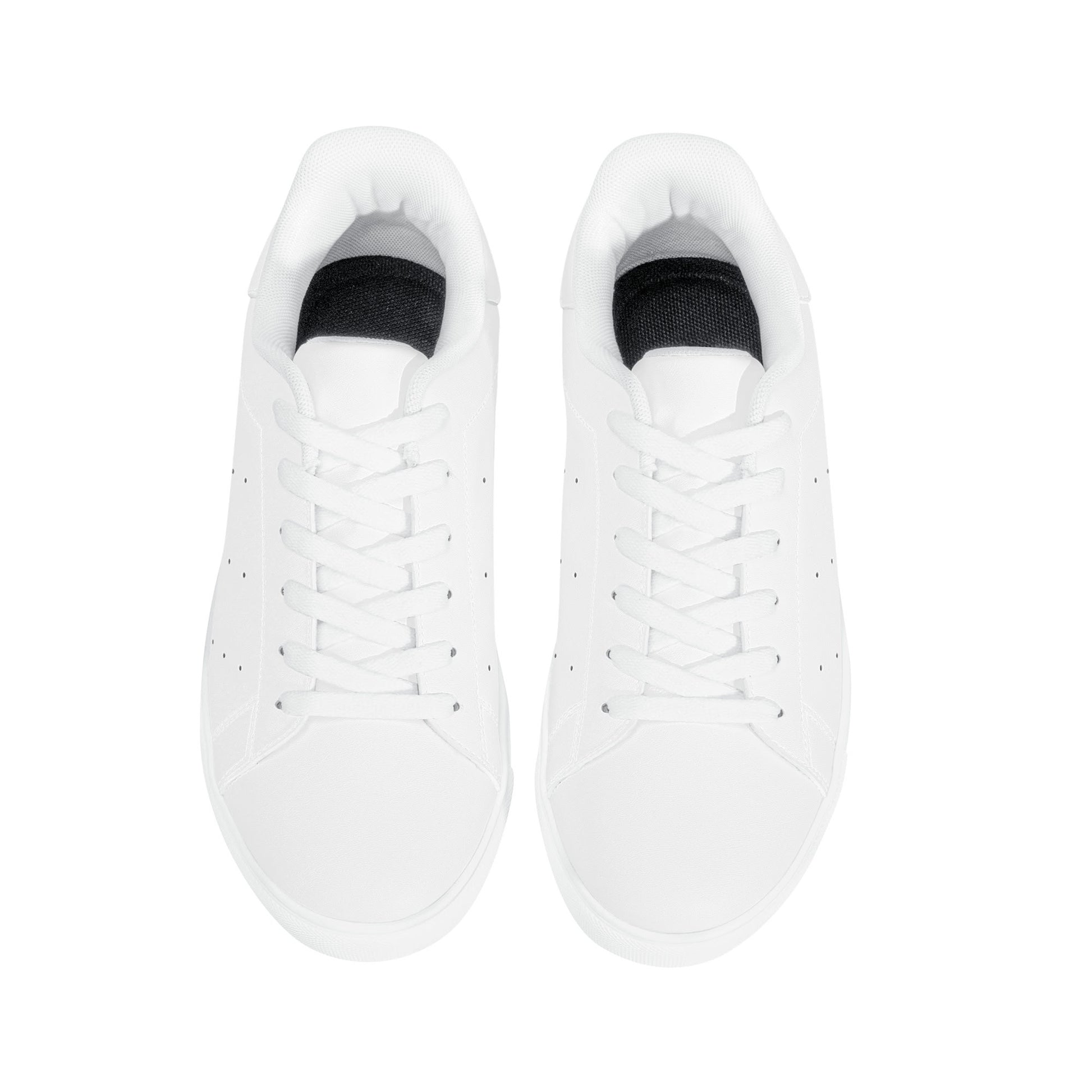 Solid white Ackee Walkers low top sneakers, black laces and black outsole