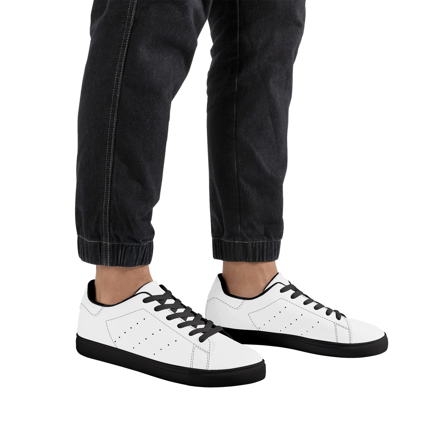 Solid white Ackee Walkers low top sneakers, black laces and black outsole