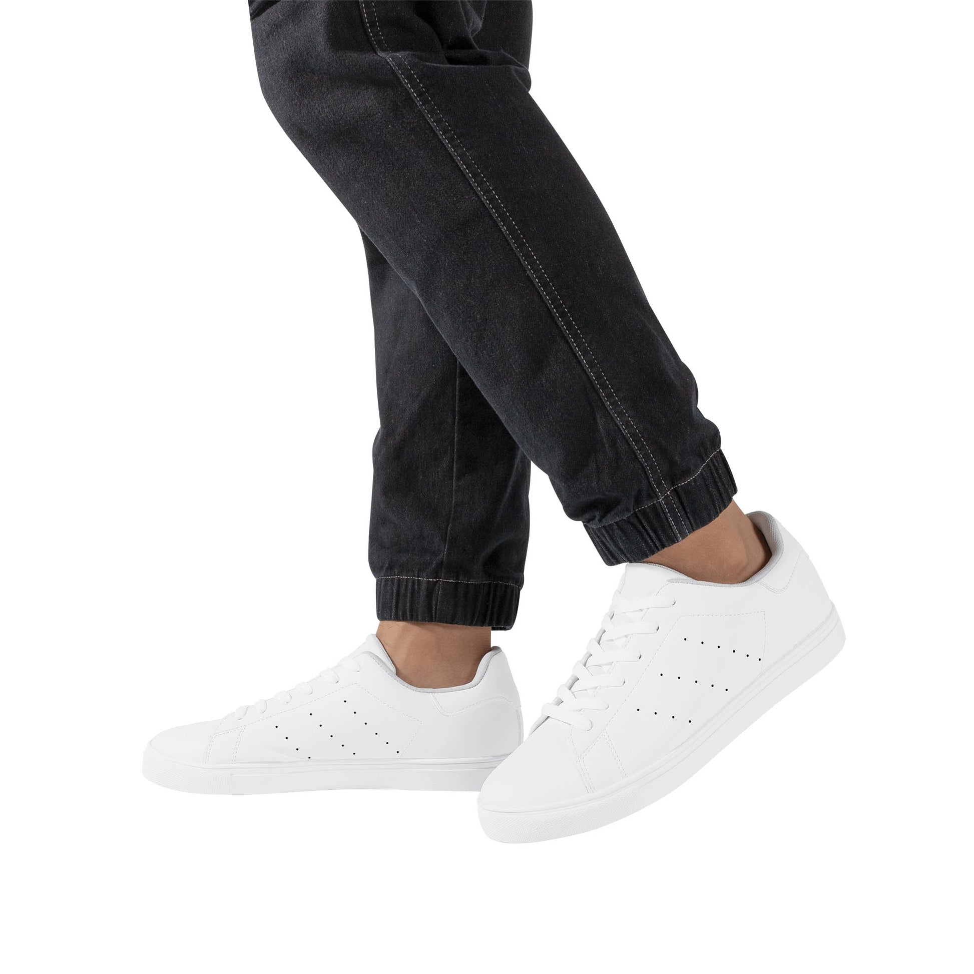 Solid white Ackee Walkers low top sneakers, black laces and black outsole