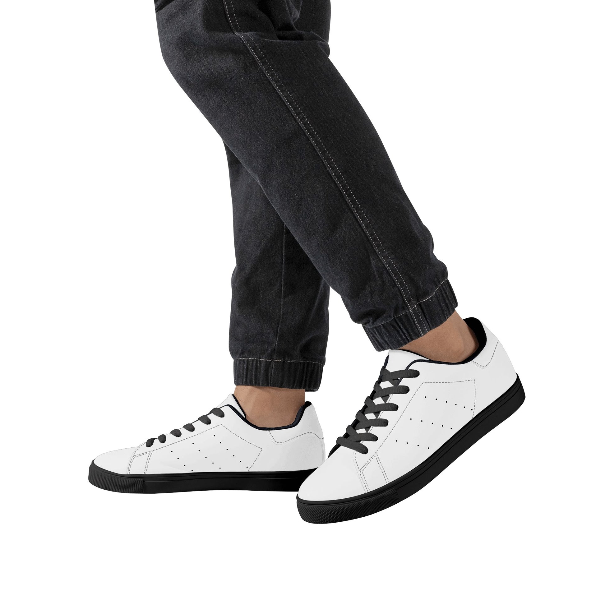 Solid white Ackee Walkers low top sneakers, black laces and black outsole