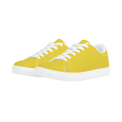 Solid marigold yellow Ackee Walkers low top sneakers, black laces and black outsole