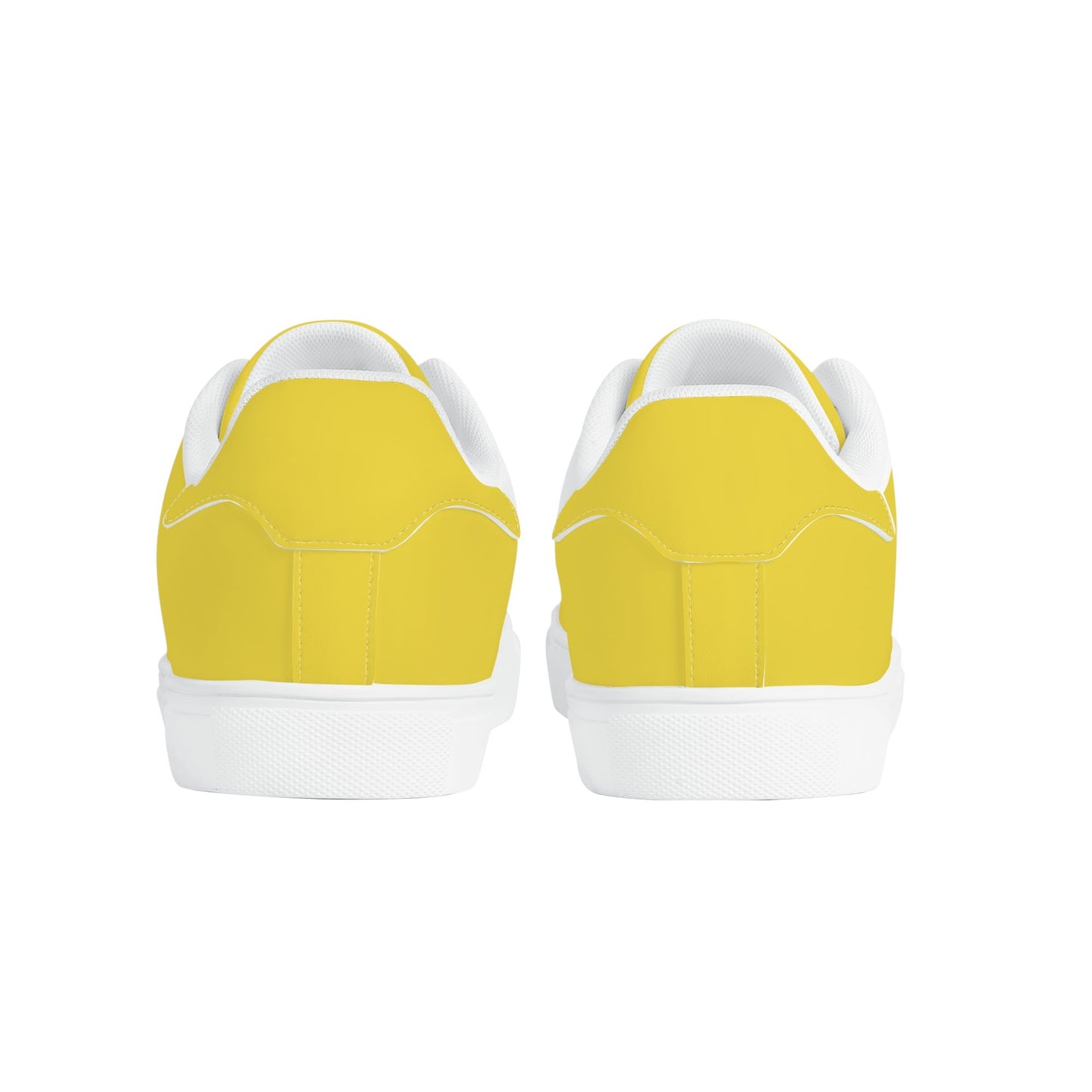 Solid marigold yellow Ackee Walkers low top sneakers, black laces and black outsole