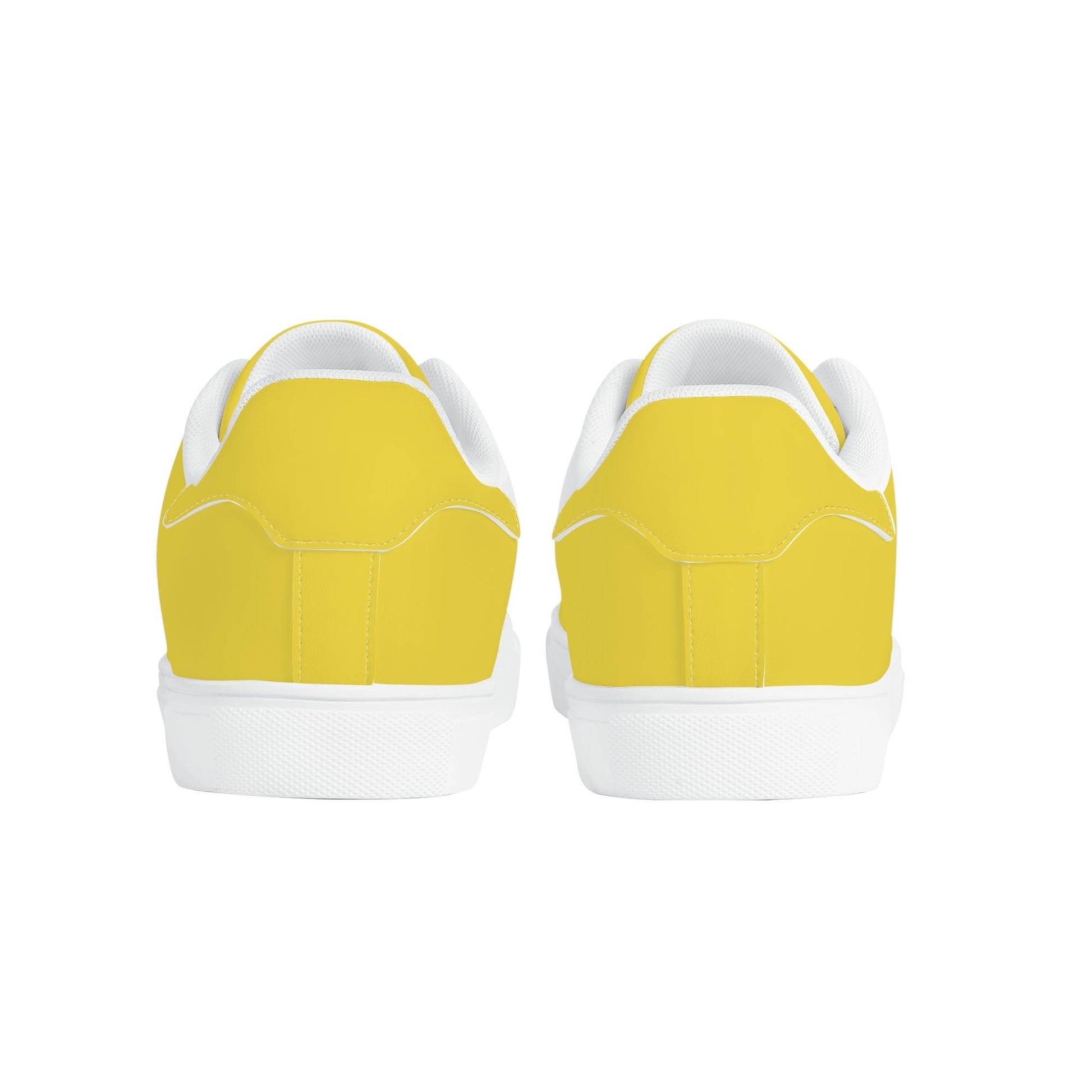 Solid marigold yellow Ackee Walkers low top sneakers, black laces and black outsole