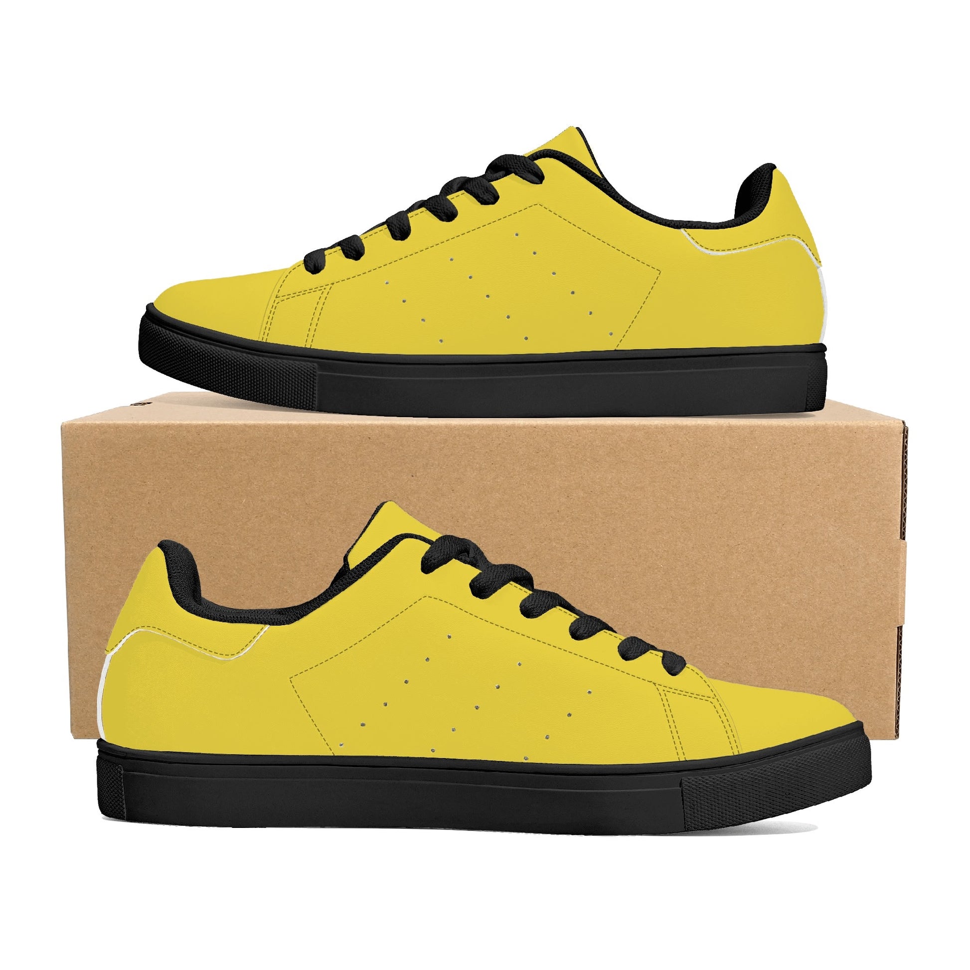 Solid marigold yellow Ackee Walkers low top sneakers, black laces and black outsole
