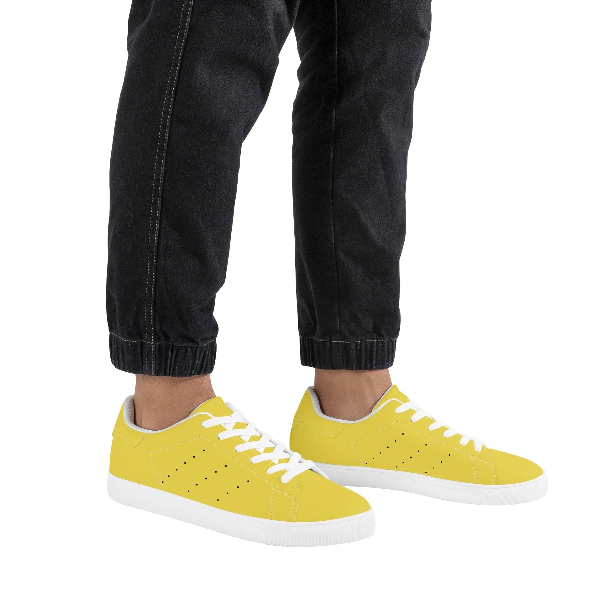 Solid marigold yellow Ackee Walkers low top sneakers, black laces and black outsole