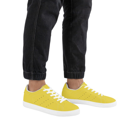 Solid marigold yellow Ackee Walkers low top sneakers, black laces and black outsole