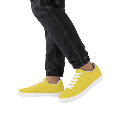 Solid marigold yellow Ackee Walkers low top sneakers, black laces and black outsole