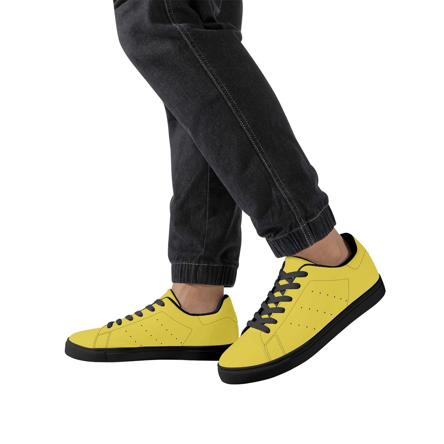 Solid marigold yellow Ackee Walkers low top sneakers, black laces and black outsole