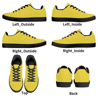 Solid marigold yellow Ackee Walkers low top sneakers, black laces and black outsole