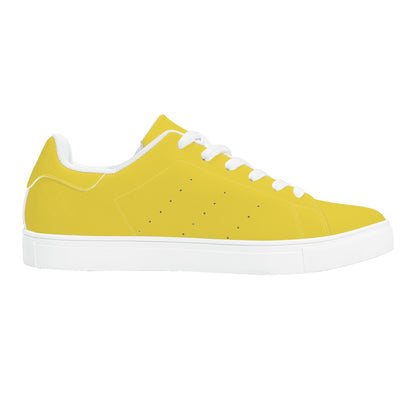 Solid marigold yellow Ackee Walkers low top sneakers, black laces and black outsole