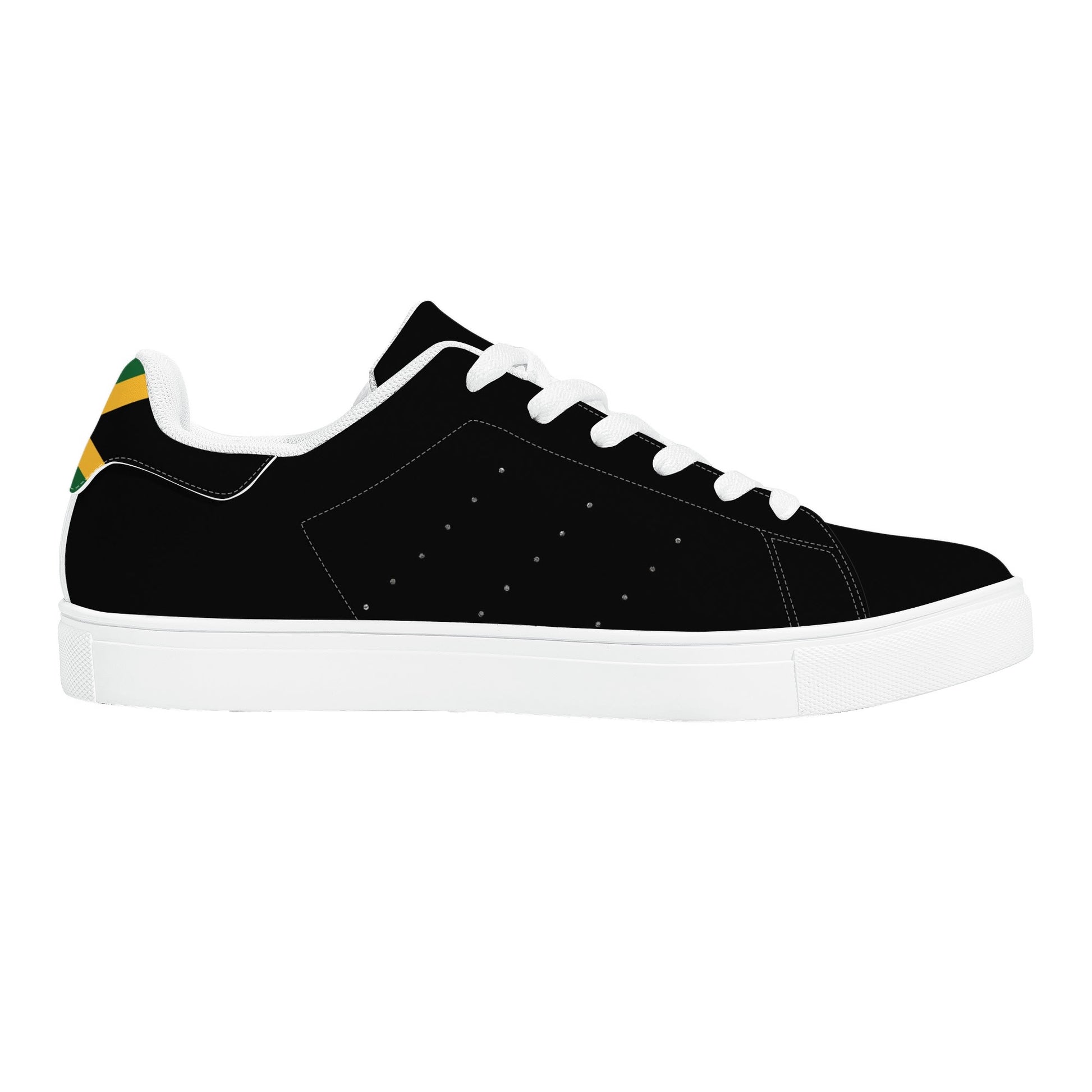 All-black Jamaica flag Ackee Walkers low top sneakers with black laces, black outsole and a green and gold Jamaican flag chevron at the heel