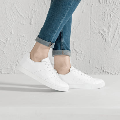 Solid white Ackee Walkers low top sneakers, black laces and black outsole
