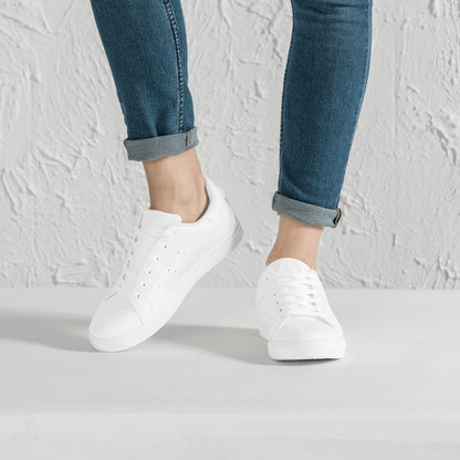 Solid white Ackee Walkers low top sneakers, black laces and black outsole