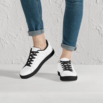 Solid white Ackee Walkers low top sneakers, black laces and black outsole