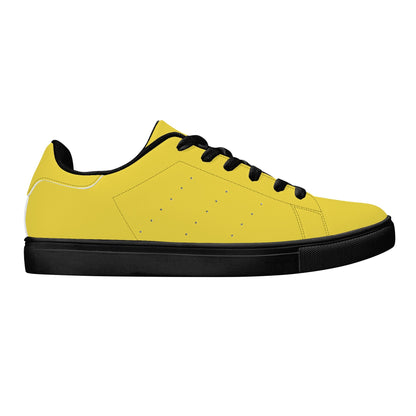 Solid marigold yellow Ackee Walkers low top sneakers, black laces and black outsole