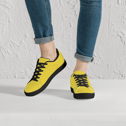 Solid marigold yellow Ackee Walkers low top sneakers, black laces and black outsole