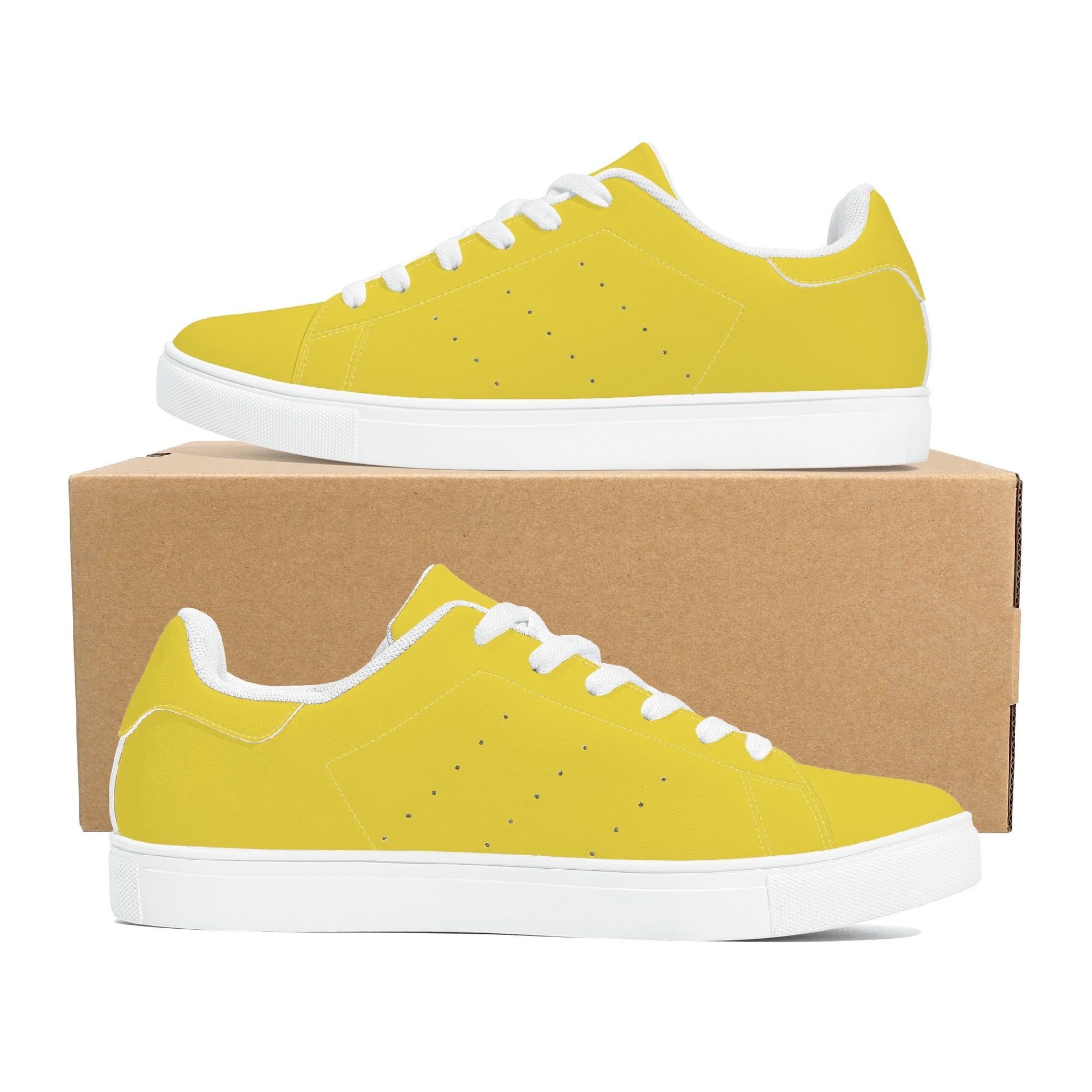 Solid marigold yellow Ackee Walkers low top sneakers, black laces and black outsole