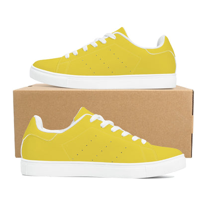 Solid marigold yellow Ackee Walkers low top sneakers, black laces and black outsole