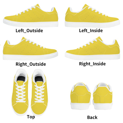Solid marigold yellow Ackee Walkers low top sneakers, black laces and black outsole