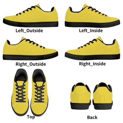Solid marigold yellow Ackee Walkers low top sneakers, black laces and black outsole