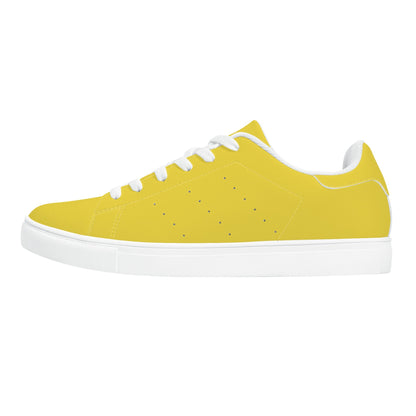Solid marigold yellow Ackee Walkers low top sneakers, black laces and black outsole