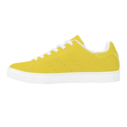 Solid marigold yellow Ackee Walkers low top sneakers, black laces and black outsole