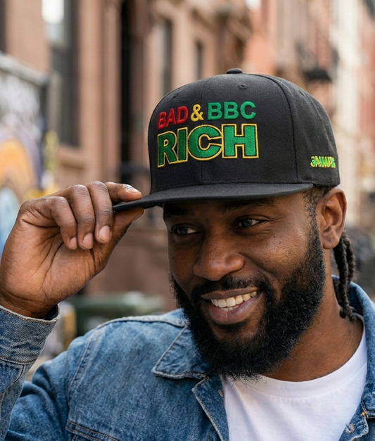 Man wearing a 'Bad & BBC Rich' cap in an urban setting