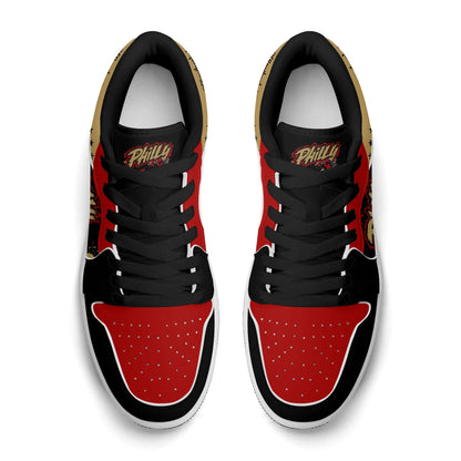 Philadelphia basketball-inspired Jamrock Low top sneakers in black with red and gold all-over city skyline graphic printed upper