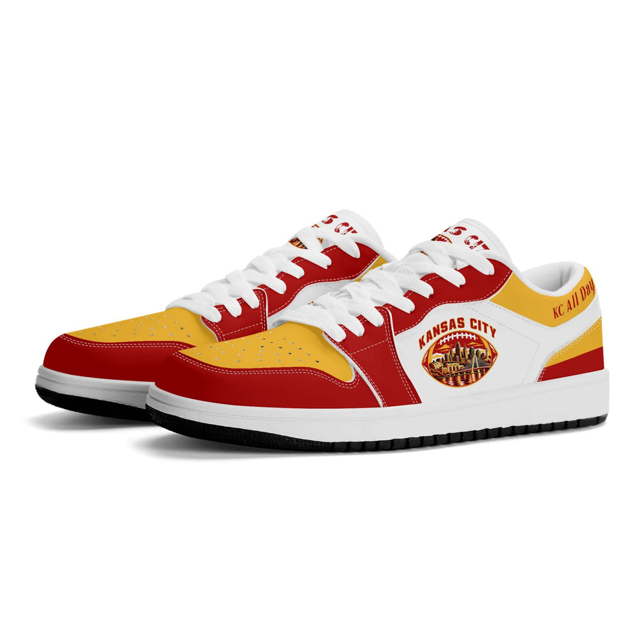 Kansas City football low tops in white, red and gold with a skyline football badge, three-quarter view, white laces