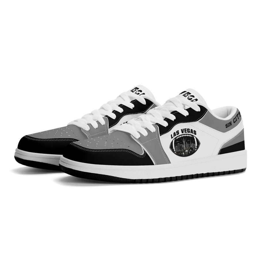 Las Vegas football low tops in white, gray and black with a night skyline football badge, three-quarter view, white laces