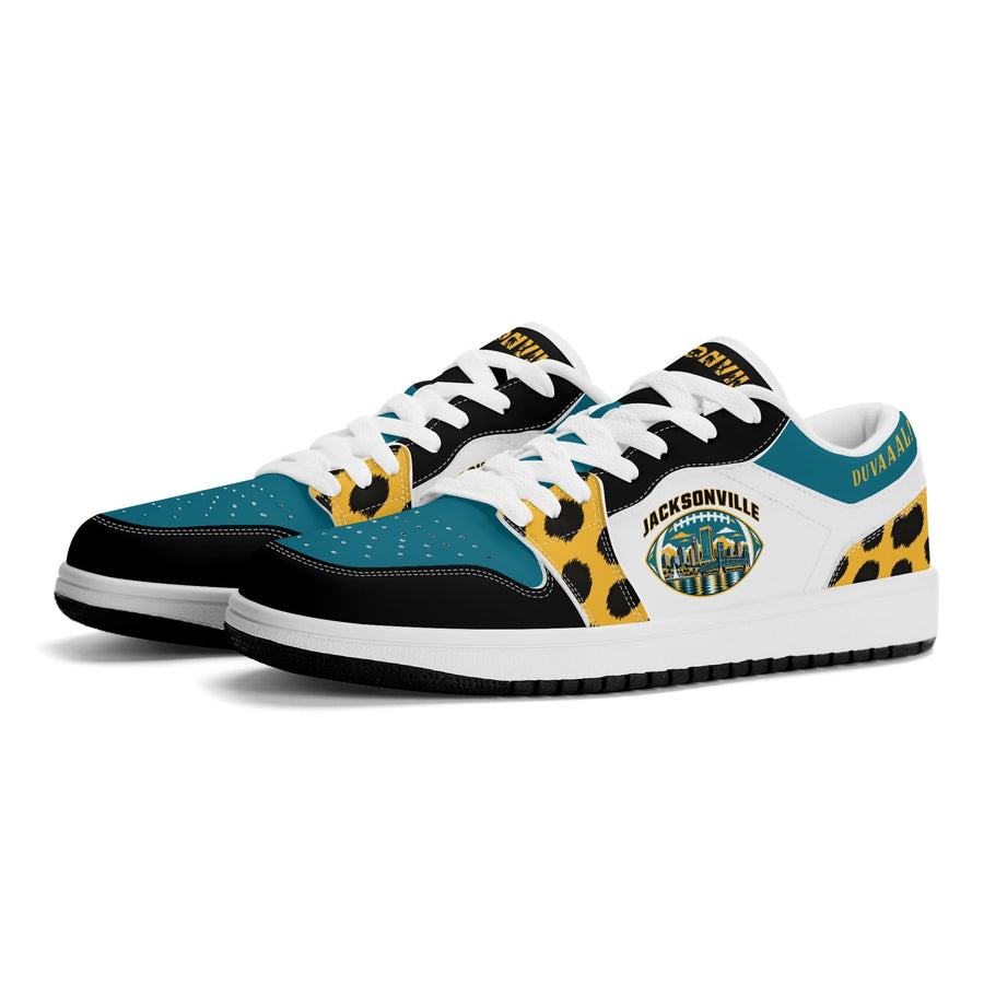 Jacksonville football low tops in white, teal and gold with a skyline football badge, three-quarter view, white laces
