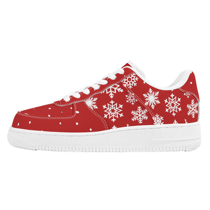 Side view of a red Christmas low top with white snowflakes across the side, white laces and a white sole