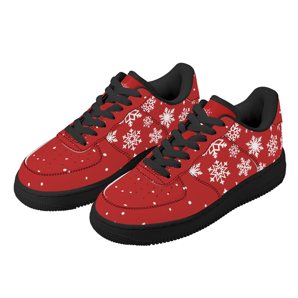 Pair of red Christmas low top sneakers with white snowflakes, black laces and black soles, three-quarter view