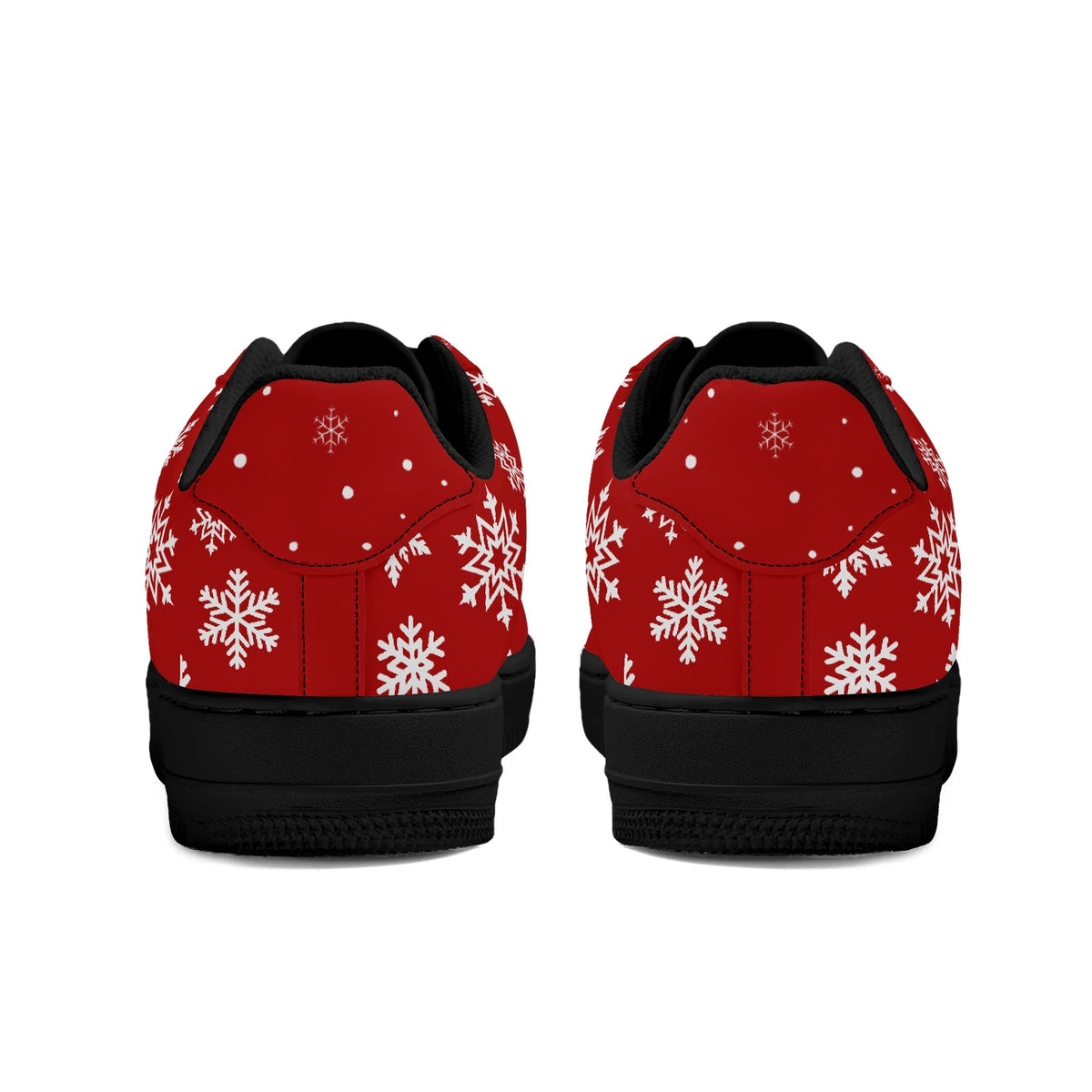 Heel view of red Christmas low tops with white snowflakes around the heel, black lining and black soles
