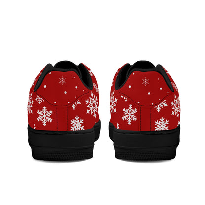 Heel view of red Christmas low tops with white snowflakes around the heel, black lining and black soles
