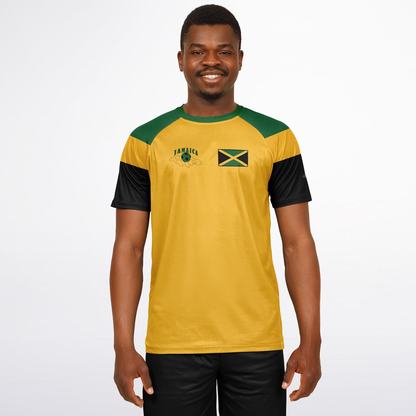 Man wearing the gold Jamaica soccer jersey with black shorts, chest flag patch visible.