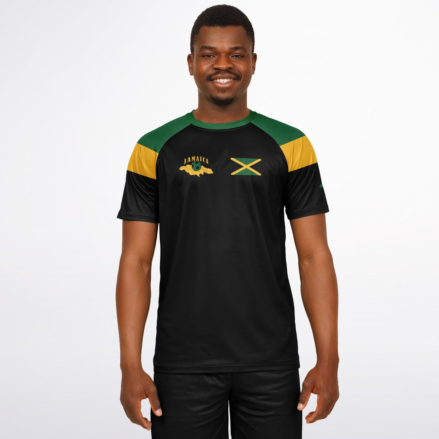 Man wearing the black Jamaica soccer jersey with green and gold shoulders, facing forward.