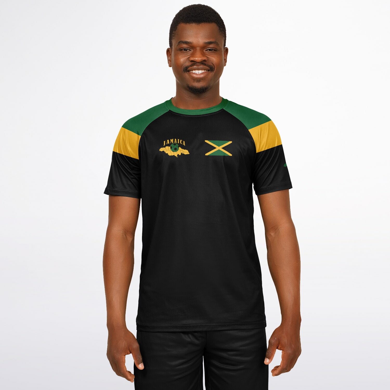 Man wearing the black Jamaica soccer jersey with green and gold shoulders, facing forward.