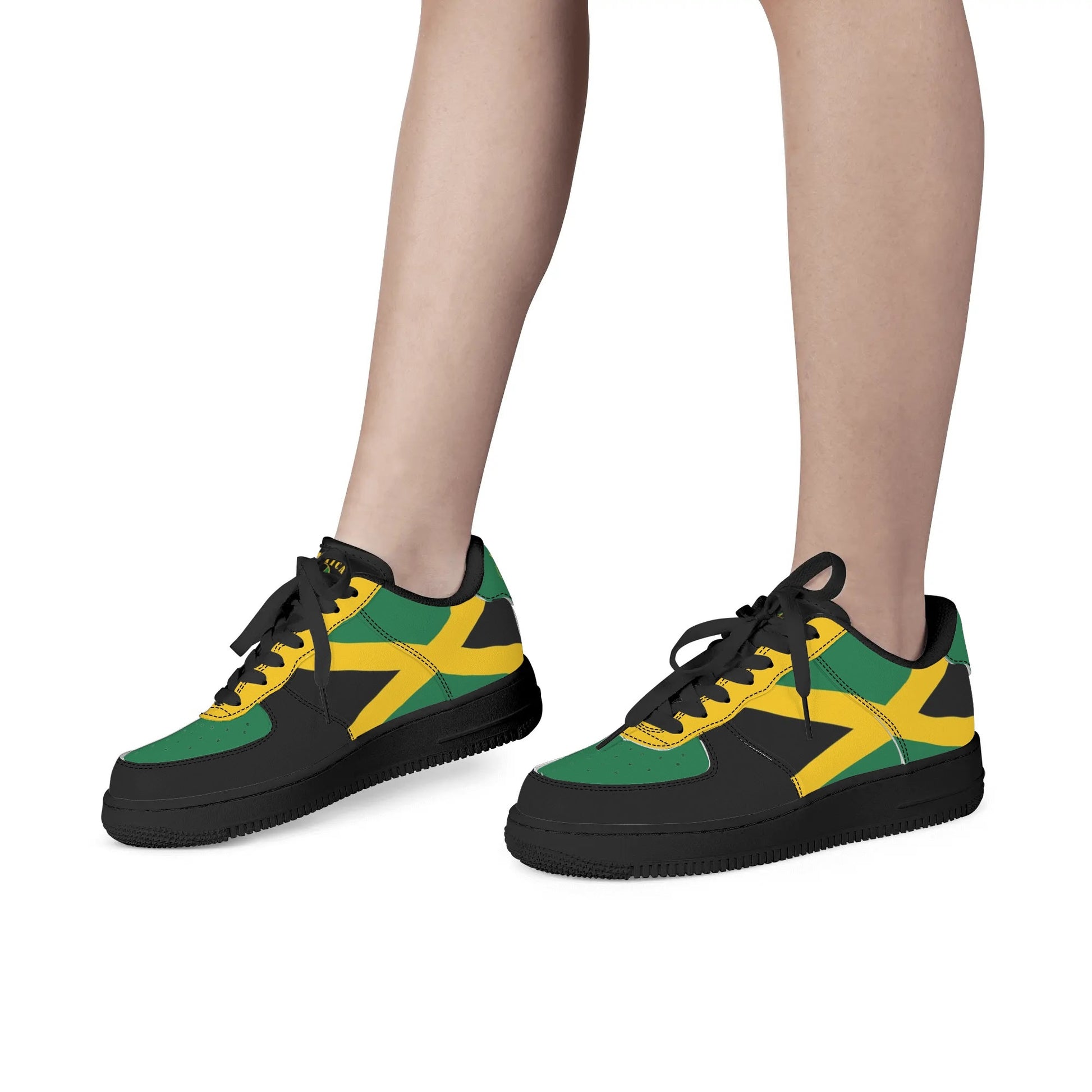 Jamaican color shoes with black, green, and gold design. Unisex Jamaican sneakers on a white background.