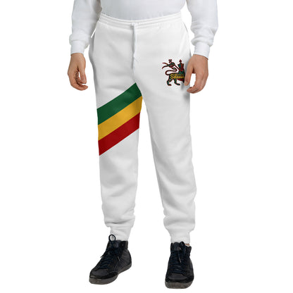 White Rasta Lion of Judah jogger sweatpants with a green, gold and red diagonal sash and a Selassie lion crest at the hip