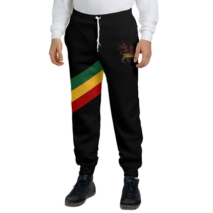 Black Rasta Lion of Judah jogger sweatpants with a green, gold and red diagonal sash and a Selassie lion crest at the hip