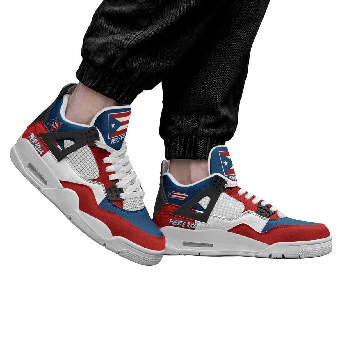 Red, white, and blue sneakers worn by a person on a wooden floor.